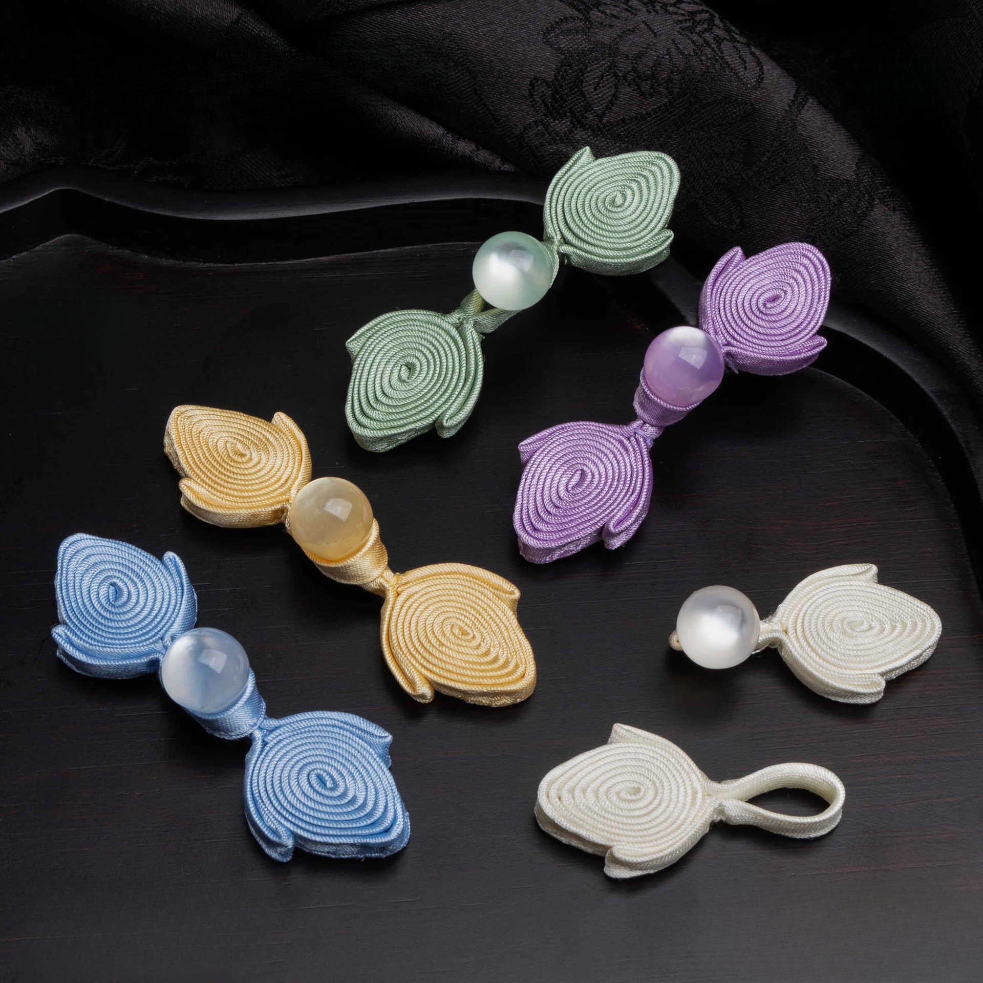 Fish Tail Spiral Knot Button with Bead - Light blue color, handmade decorative sew-on button